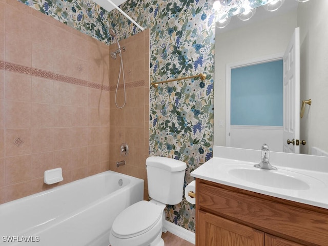 full bathroom with vanity, toilet, and tiled shower / bath combo