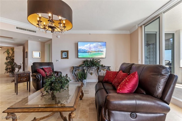 living room featuring crown molding and an inviting chandelier