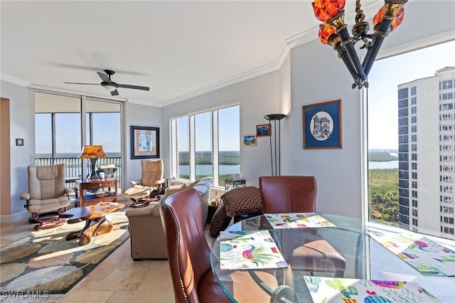 dining room featuring crown molding, a water view, and ceiling fan