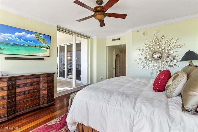 bedroom featuring dark hardwood / wood-style flooring, access to exterior, ornamental molding, and ceiling fan