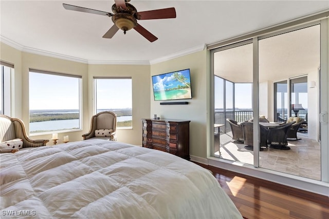 bedroom featuring multiple windows, wood-type flooring, ornamental molding, and ceiling fan