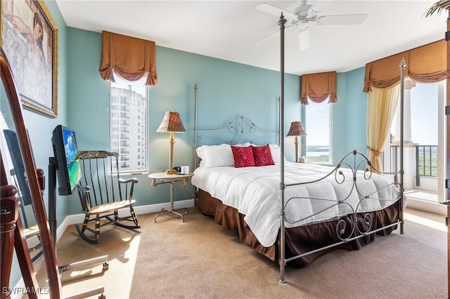 bedroom featuring light carpet and ceiling fan