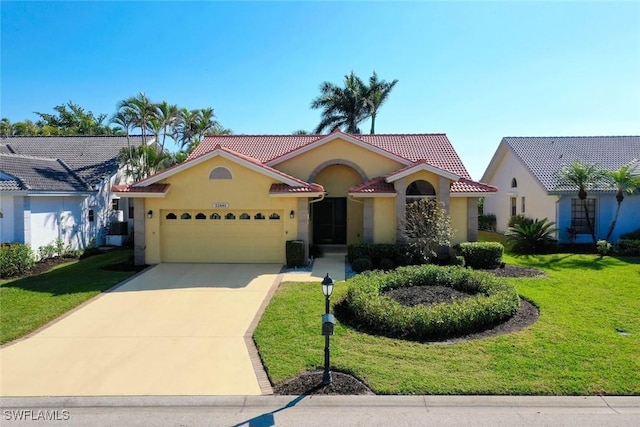 mediterranean / spanish-style house with a garage and a front yard