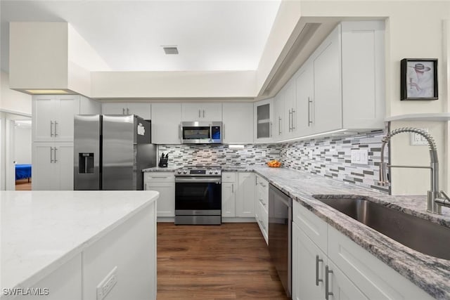 kitchen featuring white cabinetry, sink, and appliances with stainless steel finishes