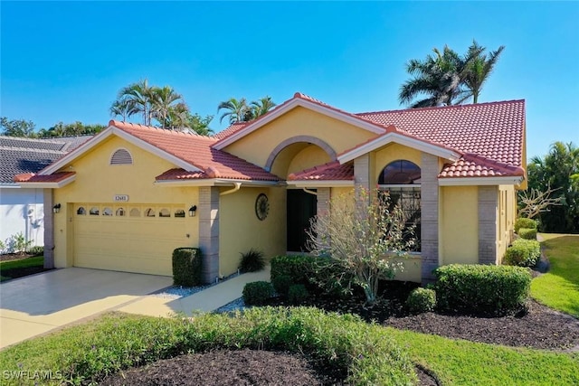 mediterranean / spanish-style home featuring a garage