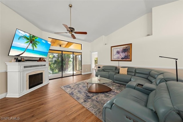 living room with high vaulted ceiling, hardwood / wood-style floors, and ceiling fan