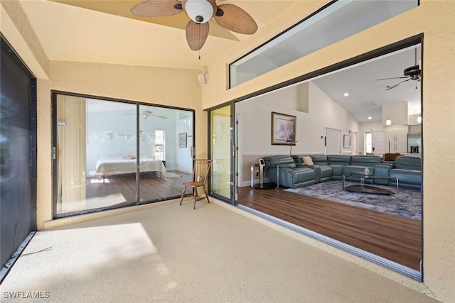 sunroom / solarium with vaulted ceiling and ceiling fan