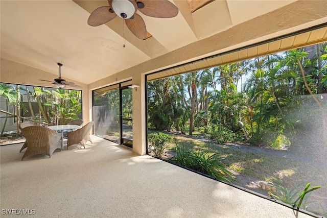 unfurnished sunroom with vaulted ceiling