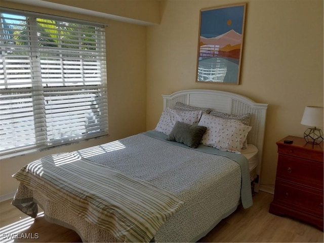 bedroom with light hardwood / wood-style floors