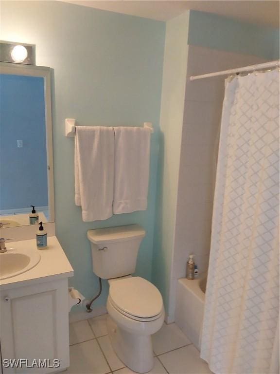 full bathroom with tile patterned flooring, shower / bath combo, vanity, and toilet