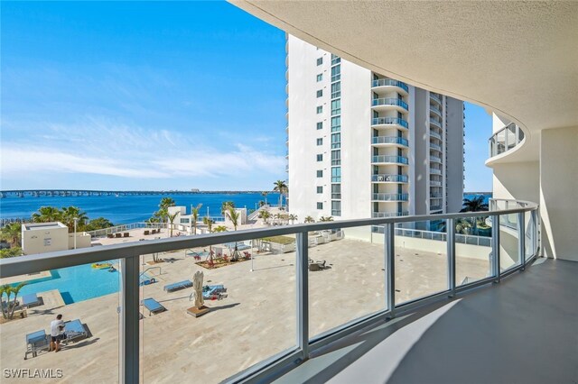 balcony featuring a water view