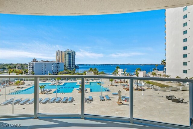 balcony featuring a water view