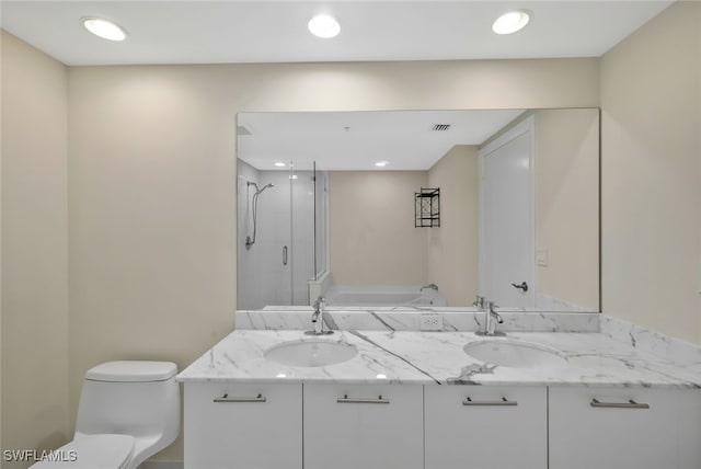 full bathroom featuring vanity, plus walk in shower, and toilet