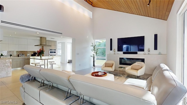 tiled living room with high vaulted ceiling and wood ceiling