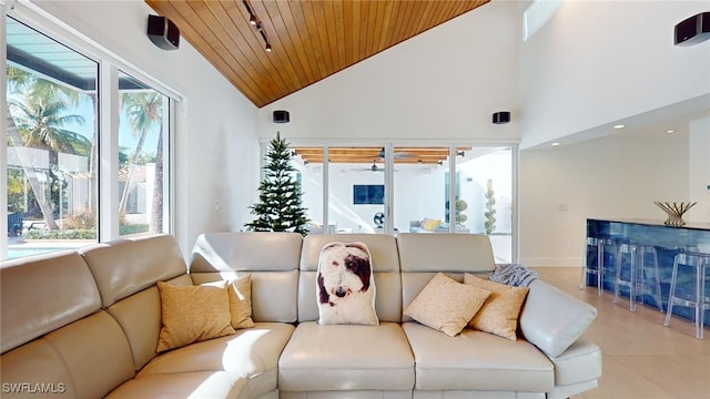 living room featuring wooden ceiling and high vaulted ceiling