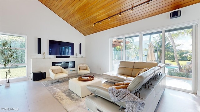 tiled living room featuring high vaulted ceiling, a wealth of natural light, wooden ceiling, and rail lighting