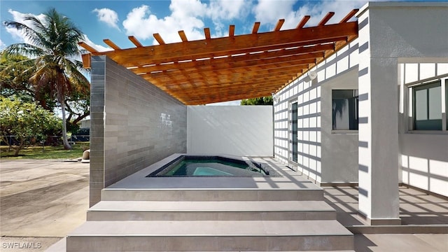 view of pool featuring an in ground hot tub, a patio area, and a pergola