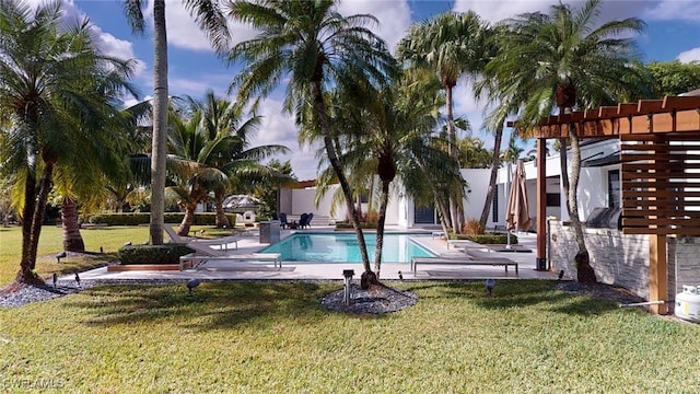 view of pool with a lawn, a patio area, and a pergola