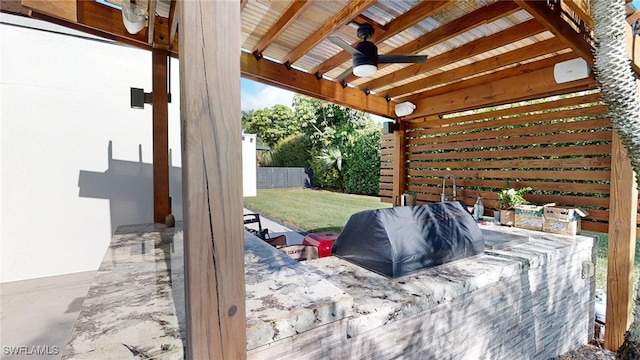 view of patio featuring ceiling fan