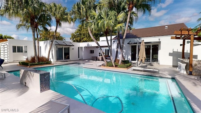 view of swimming pool featuring a pergola and a patio area