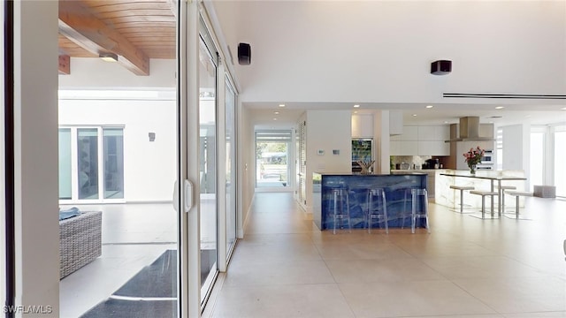 corridor featuring beam ceiling