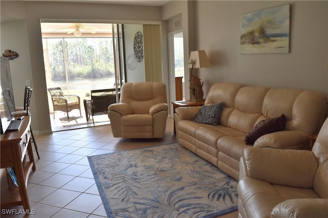 tiled living room featuring ceiling fan