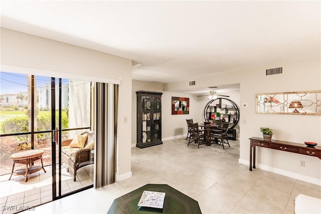 living area with ceiling fan