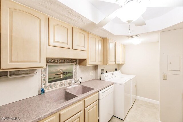 laundry area featuring separate washer and dryer and sink