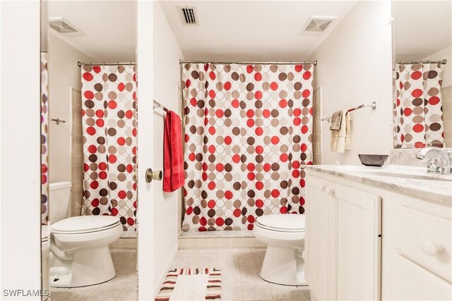 bathroom with tile patterned flooring, vanity, a shower with shower curtain, and toilet