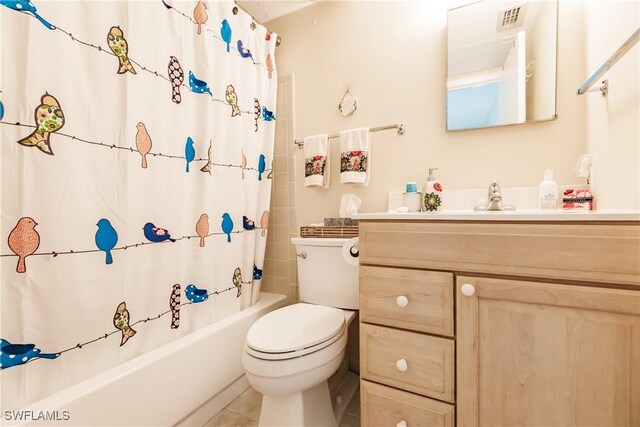 full bathroom with vanity, toilet, and shower / bath combo with shower curtain