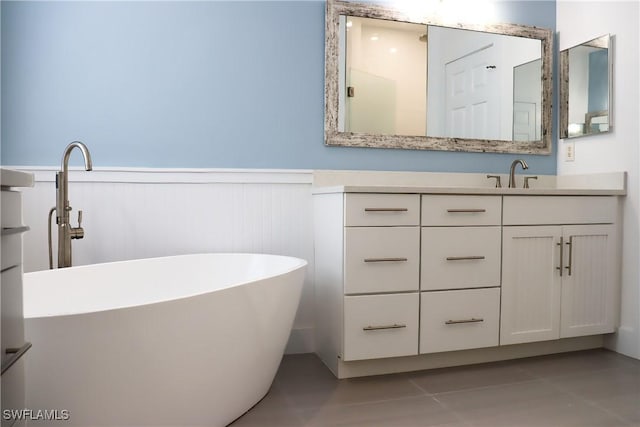 bathroom with vanity and a bathtub