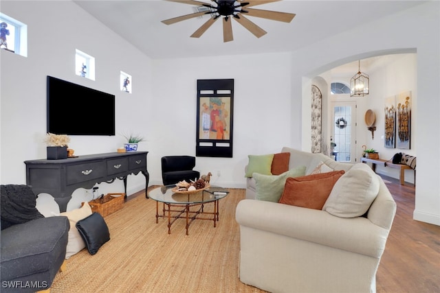 living room with ceiling fan and light wood-type flooring