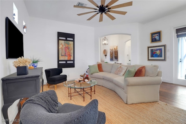 living room with ceiling fan and light wood-type flooring