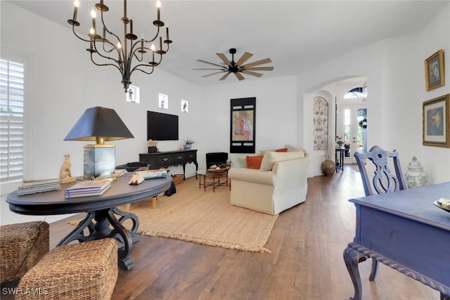 living room with ceiling fan, wood-type flooring, and a wealth of natural light