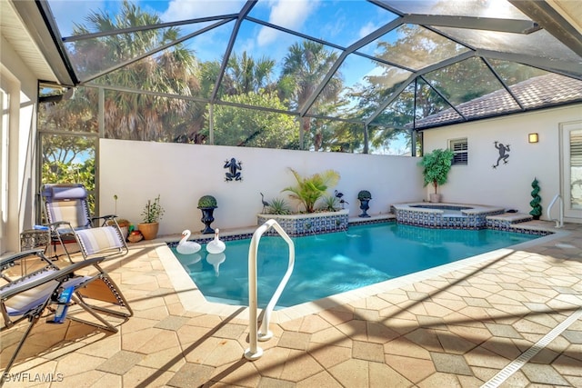 view of pool featuring an in ground hot tub, a lanai, and a patio