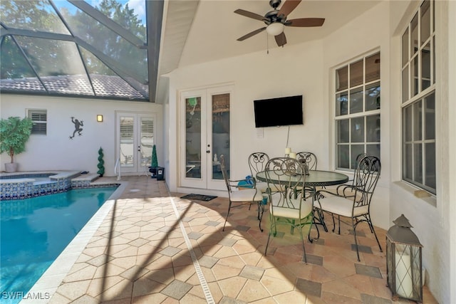 sunroom featuring french doors and ceiling fan