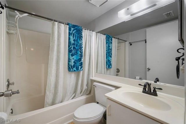 full bathroom featuring shower / bathtub combination with curtain, vanity, and toilet