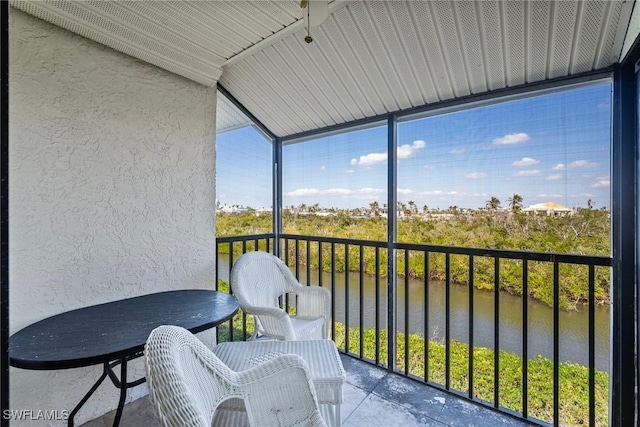 sunroom with a water view