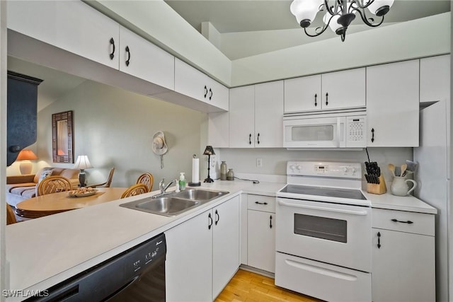 kitchen featuring white cabinetry, white appliances, sink, and light wood-type flooring