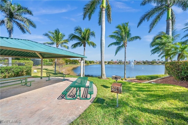view of property's community featuring a yard, a gazebo, and a water view