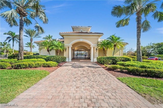 view of building exterior featuring decorative driveway