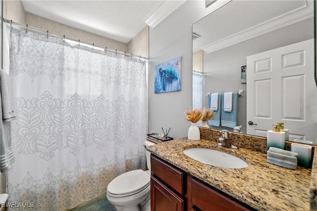 bathroom with vanity, ornamental molding, and toilet
