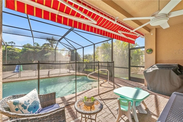 view of pool featuring a fenced in pool, a patio area, ceiling fan, and a lanai