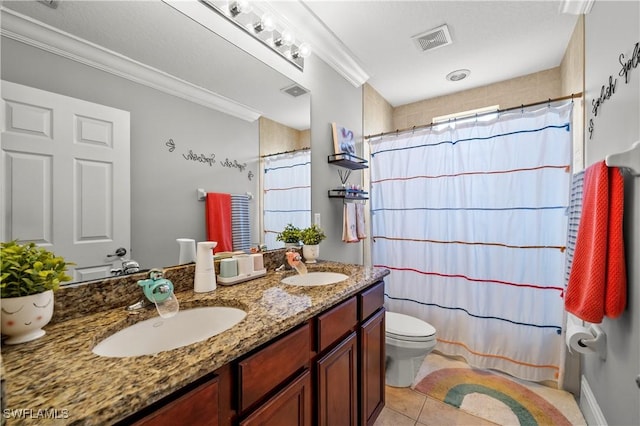 bathroom with crown molding, vanity, a shower with curtain, tile patterned floors, and toilet