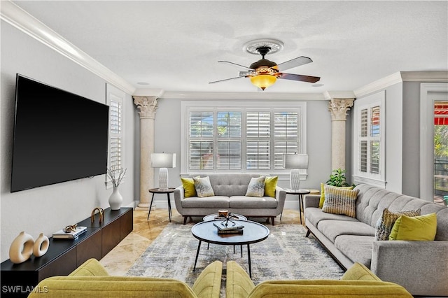 living room featuring ornamental molding, decorative columns, and ceiling fan