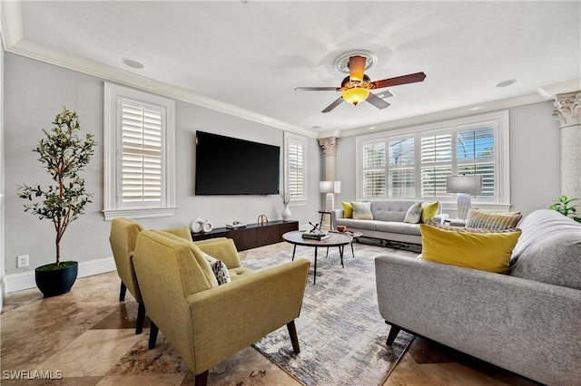 living room featuring ornamental molding, baseboards, and a ceiling fan