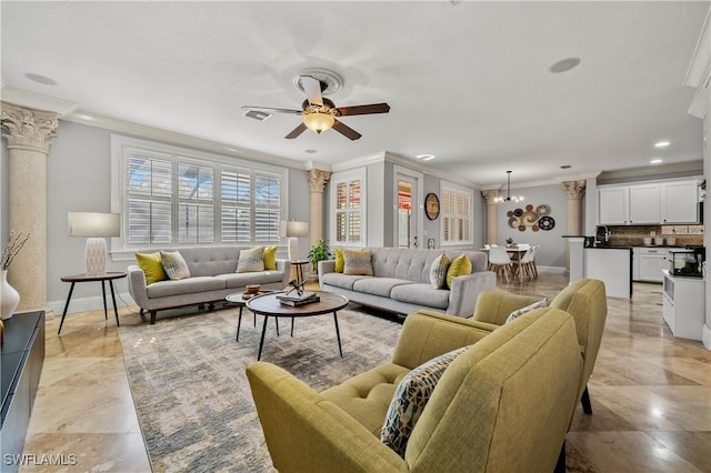 living area with crown molding, visible vents, and ornate columns
