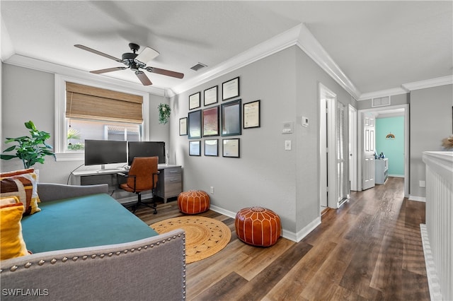 home office featuring ornamental molding, dark wood-type flooring, and ceiling fan