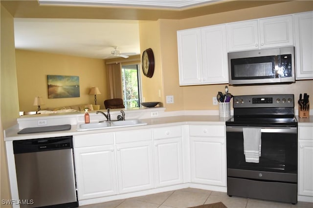 kitchen featuring white cabinetry, sink, stainless steel appliances, and ceiling fan