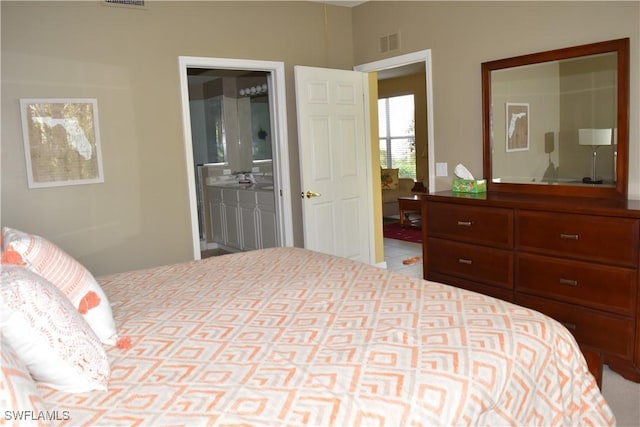 bedroom featuring ensuite bath